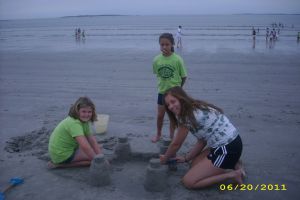 Building sand castles at the ocean